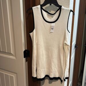 New York and company cold shoulder sweater. Cream and black trim.